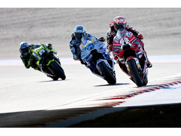 Ducati Lenovo Team rider Francesco Bagnaia of Italy (R) leads BK8 Gresini Racing MotoGP rider Alex Marquez of Spain (C) and SuperFile Trackhouse MotoGP Team rider Raul Fernandez of Spain (L) during the MotoGP class practice session of MotoGP Japanese Grand Prix at the Mobility Resort Motegi in Motegi, Tochigi prefecture on October 2, 2026. (Photo by Toshifumi KITAMURA / AFP)
