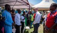 French Minister for Europe and Foreign Affairs Jean-Noël Barrot speaks with family members of Ebola patients during his visit to the Rwampara Ebola Treatment Centre in Bunia, Ituri Province, Democratic Republic of Congo, on October 3, 2026. (Photo by Hardy BOPE / AFP)