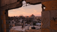 A Palestinian man cleans the roof of a building at the Jabalia refugee camp in the northern Gaza Strip on October 5, 2026. Photo by Bashar Taleb / AFP