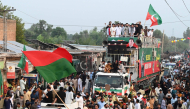 Supporters of jailed former prime minister Imran Khan's Pakistan Tehreek-e-Insaf (PTI) take part in a march in Khyber district of Pakistan's Khyber Pakhtunkhwa province on October 7, 2026. (Photo by Abdul Majeed / AFP)