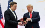 Tesla and SpaceX CEO Elon Musk (L) receives the National Medal of Science from U.S. President Donald Trump during the Golden Age of American Innovation Summit at the Institute of Peace on October 08, 2026 in Washington, DC. Photo by WIN MCNAMEE / GETTY IMAGES NORTH AMERICA / Getty Images via AFP