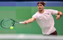 Germany's Alexander Zverev hits a return to China's Wu Yibing during their men's singles match at the Shanghai Masters tennis tournament in Shanghai on October 9, 2026. (Photo by Hector RETAMAL / AFP)