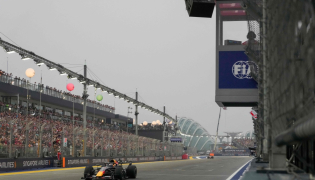 Red Bull Racing's Dutch driver Max Verstappen wins the sprint race ahead of the Formula One Singapore Grand Prix at the Marina Bay Street Circuit in Singapore on October 10, 2026. (Photo by Ng Han Guan / Pool / AFP)