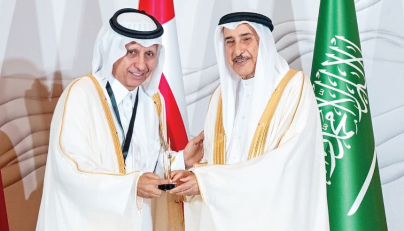 Deputy Prime Minister of the Kingdom of Bahrain H E  Sheikh Khalid bin Abdullah Al Khalifa presenting the award to Chairman of the Board of Directors of QCS Sheikh Dr. Khalid bin Jabor Al Thani. 