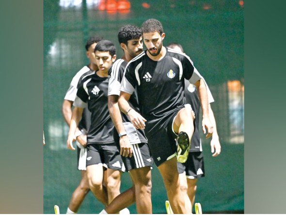 Al Gharafa players in action during a training session.