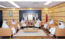 Officials from the two entities during a meeting in Doha