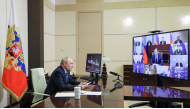 In this pool photograph distributed by the Russian state agency Sputnik, Russia's President Vladimir Putin chairs a meeting on cybersecurity with government and business members via videolink at the Novo-Ogaryovo residence outside Moscow on October 14, 2026. (Photo by Mikhail METZEL / POOL / AFP)
