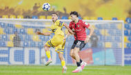 Action during the match between Al Rayyan and Al Taawoun.