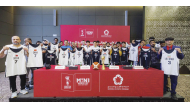 Representatives from the participating teams pose with their jerseys. 