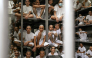 Inmates are pictured during a visit of Costa Rica's President Laura Fernandez at the CECOT prison in Tecoluca, El Salvador on October 16, 2026. (Photo by Marvin RECINOS / AFP)