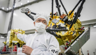 (FILES) Yasuhiro Kawakatsu, project manager of the Mars Moons eXploration (MMX) mission, speaks to media in front of the MMX spacecraft at the Tanegashima Space Center in Minamitane, Kagoshima prefecture on August 13, 2026. (Photo by Yuichi YAMAZAKI / AFP) 