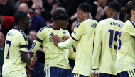 Arsenal's English midfielder #20 Noni Madueke (2L) celebrates scoring the team's first goal with teammates during the English Premier League football match between Nottingham Forest and Arsenal at The City Ground in Nottingham, central England, on October 18, 2026. (Photo by Darren Staples / AFP) 