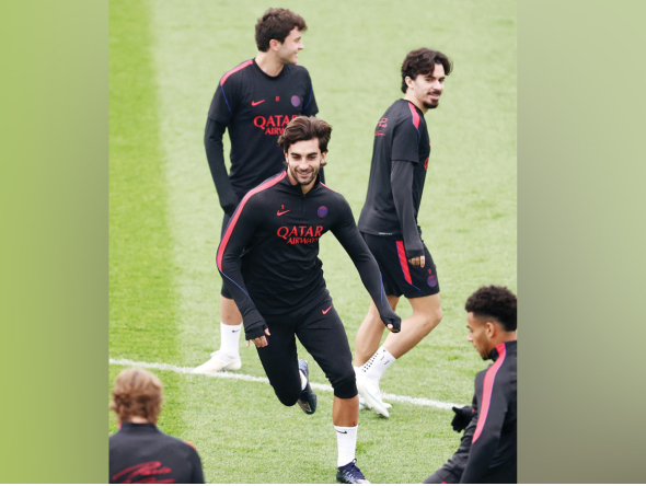 PSG’s Ferran Torres (centre) attends a training session with teammates.