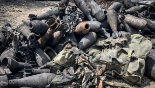 Mortar shells and other ammunition remnants lie scattered along a road following clashes between Ethiopian federal forces and armed groups opposed to the government in Adigrat on October 17, 2026. AFP.