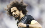 Al Sadd's Akram Afif celebrates after scoring a goal.