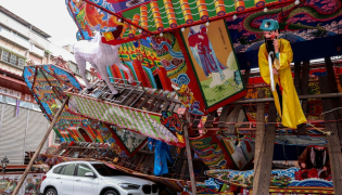 A temporary structure built for a traditional Taoist religious ceremony lies collapsed due to strong winds from Typhoon Champi in Keelung on October 24, 2026. (Photo by I-Hwa Cheng / AFP)
