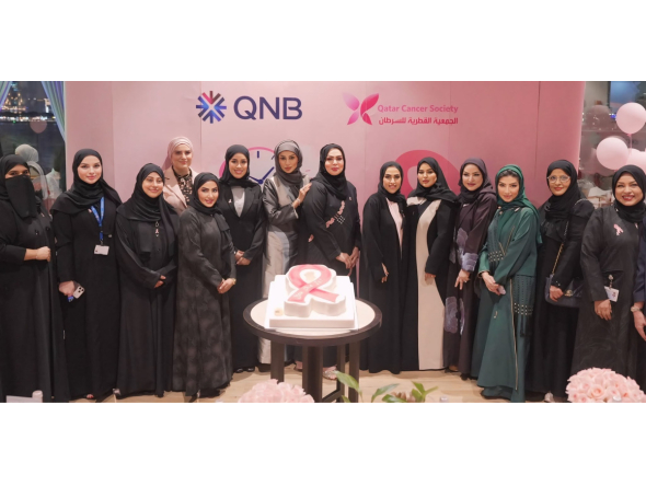 QNB Group and QCS officials at a breast cancer awareness event.