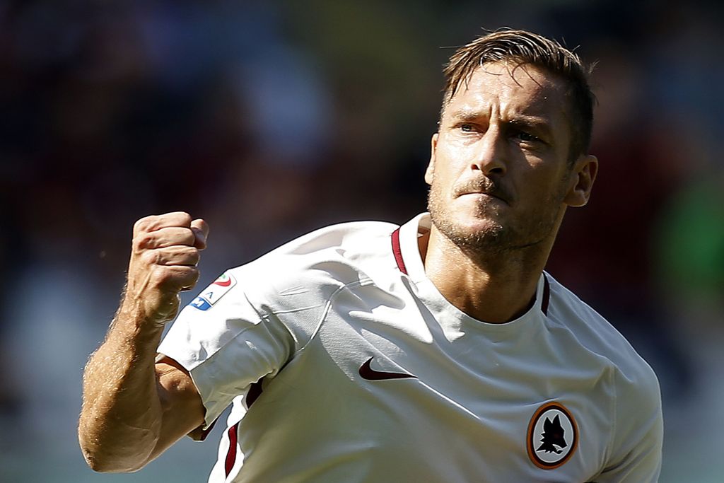 AS Roma's forward Francesco Totti celebrates after scoring a goal during the Italian Serie A football match between Torino and AS Roma at the 