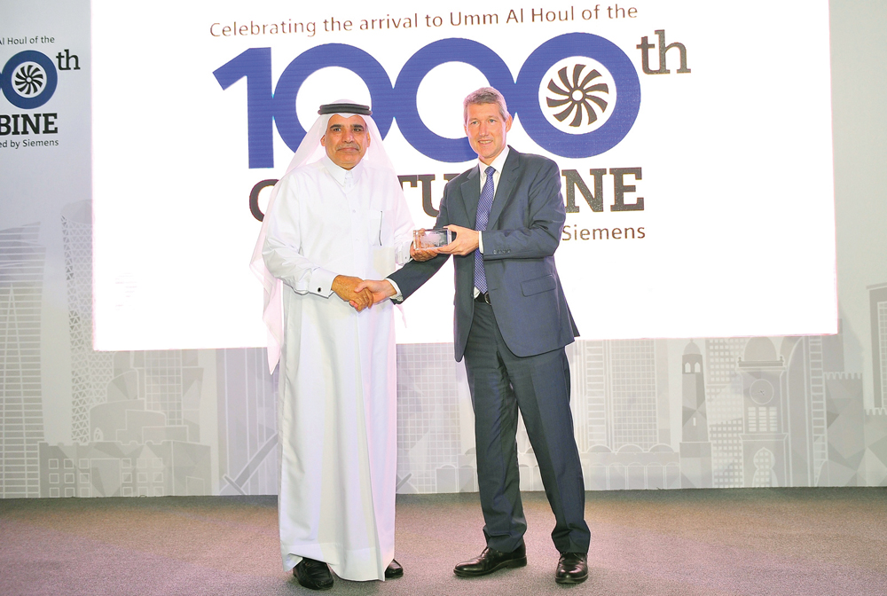 Adrian Wood (right), CEO of Siemens in Qatar with Fahad Al Mohannadi, Chairman of Umm Al Houl and CEO of Qatar Electricity and Water Company during the event in Doha yesterday. Pic: Baher Amin/The Peninsula