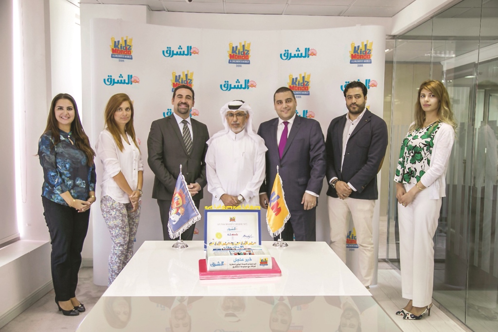 Jaber Al Harami (centre), Editor-in-Chief, Al Sharq, and Nabil R Barakat (third left), General Manager, KidzMondo Doha, with other officials at the signing of a memorandum of understanding for setting up Al Sharq Newspaper establishment at the e