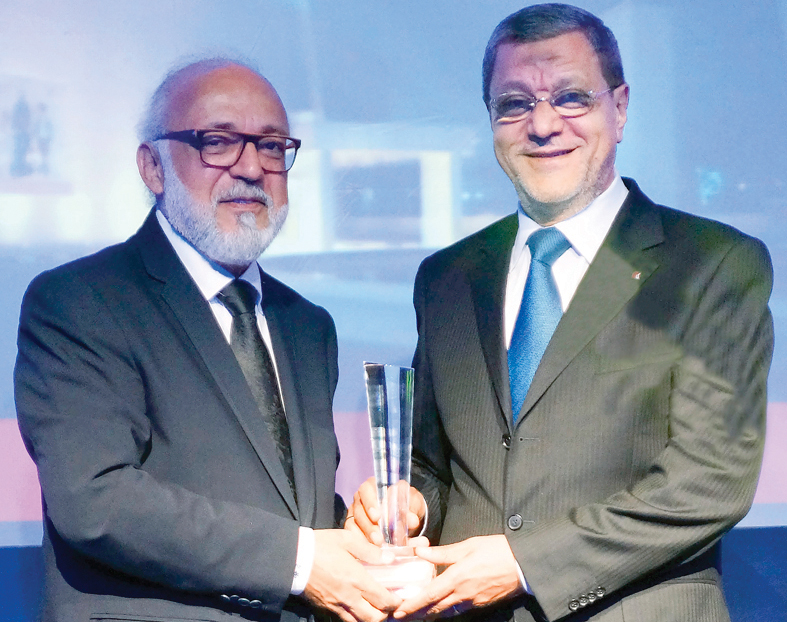 Fifty One East official receiving the award.