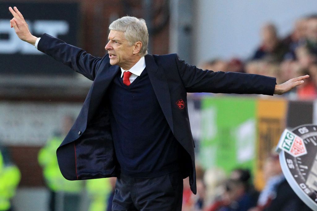 Celebrating twenty years in charge of Arsenal, Arsenal's French manager Arsene Wenger reacts on the touchline during the English Premier League football match between Burnley and Arsenal at Turf Moor in Burnley, north west England on October 2, 2016. Arse