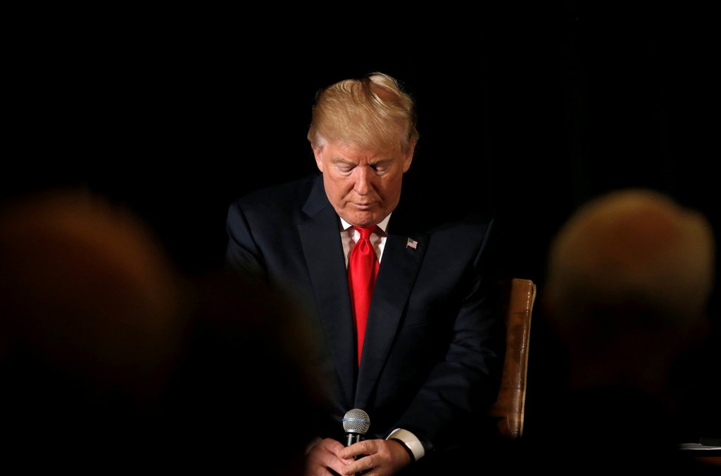 Republican presidential nominee Donald Trump pauses before answering questions at the 