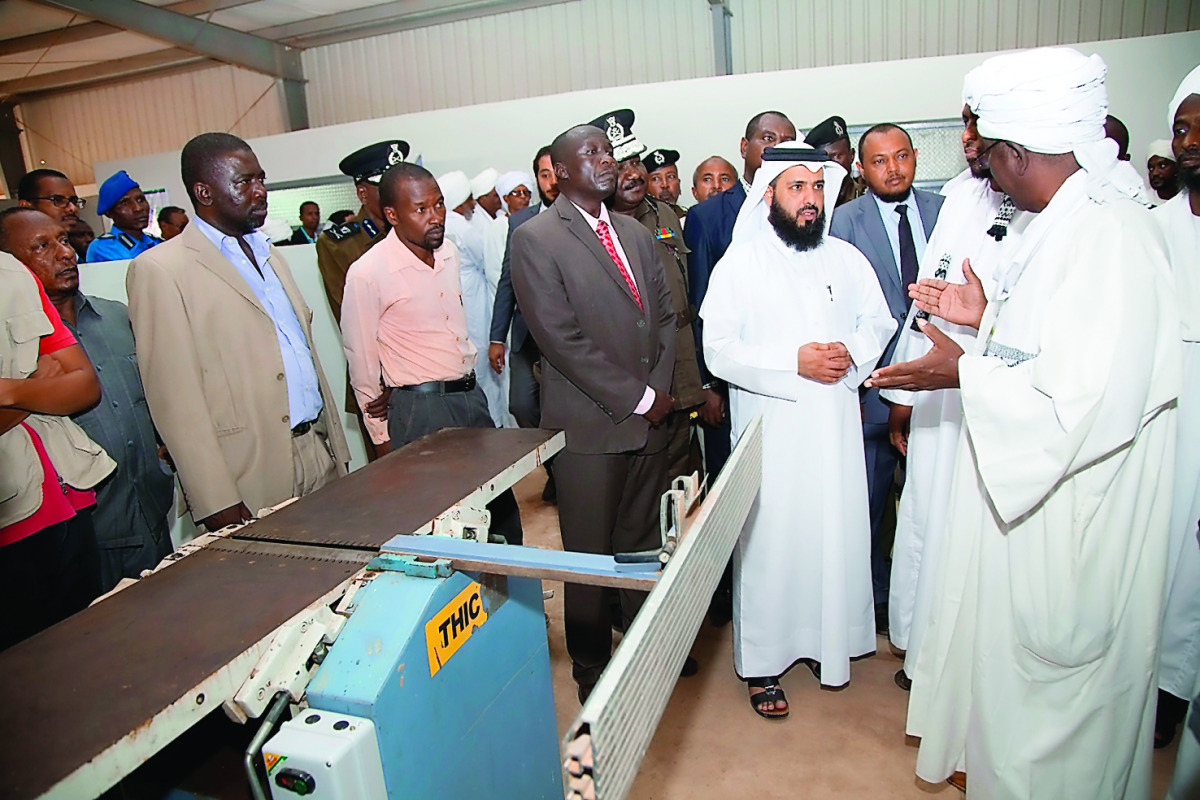 Dr. Ayed bin Dabssan Al Qahtani, Chairman, Board of Trustees and General Director, RAF, with local officials at the vocational training centre opened in a jail in Khartoum.