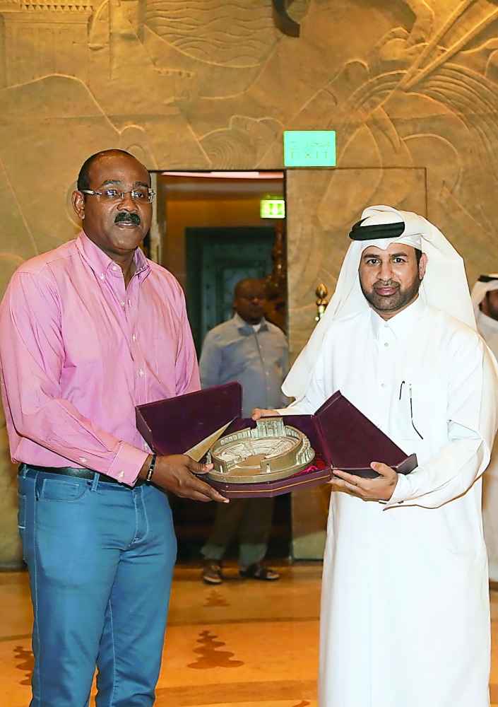 Katara General Manager Dr Khalid bin Ibrahim Al Sulaiti presents a memento to the Prime Minister of Antigua and Barbuda, Gaston Browne.