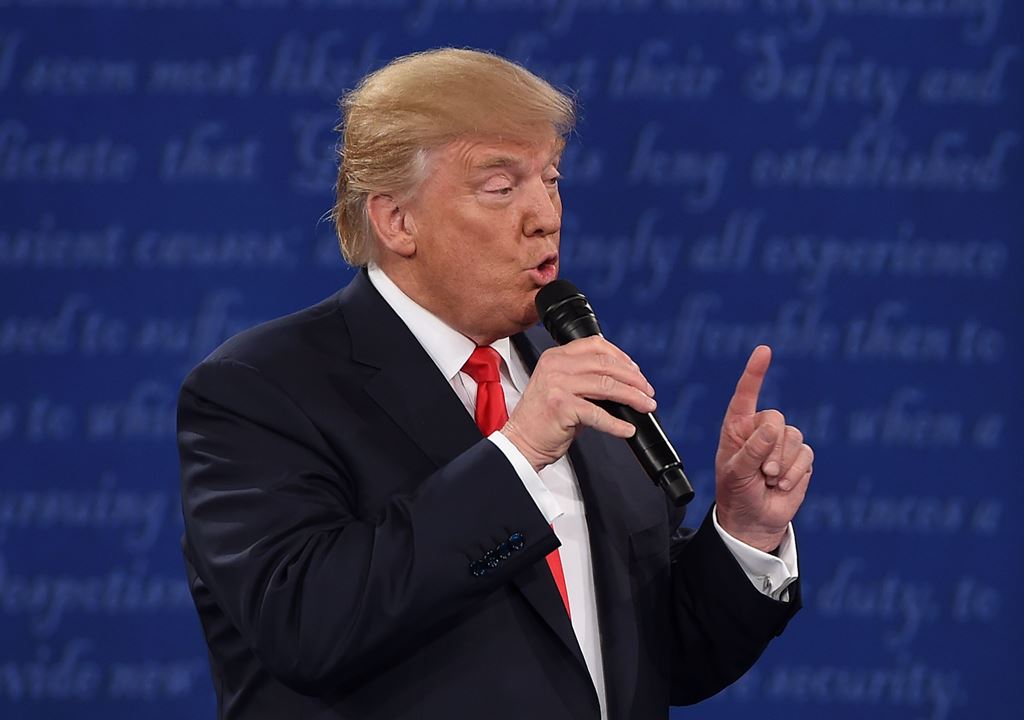 US Republican presidential candidate Donald Trump speaks during the second presidential debate at Washington University in St. Louis, Missouri, on October 9, 2016. / AFP / Robyn Beck