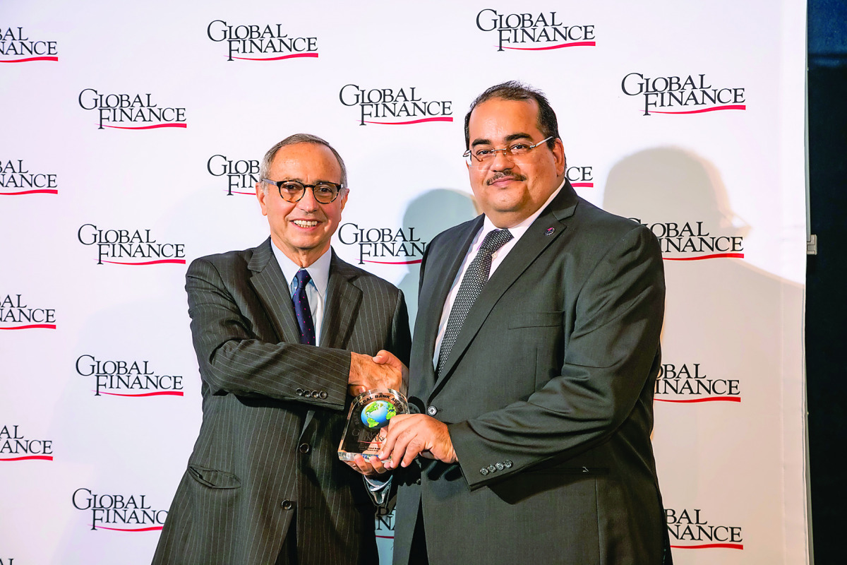 Yousuf Ali Darwish (right), General Manager, Group Communications, QNB, receiving the award. 