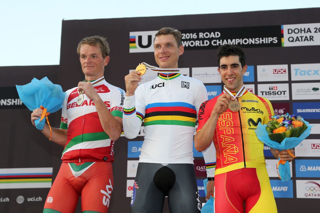Germany's gold medallist Tony Martin (C), Belarus' silver medallist Vasil Kiryienka (L) and Spain's bronze medallist Jonathan Castroviejo celebrate on the podium at the end of the men's elite individual time trial event as part of the 2016 UCI Road World 