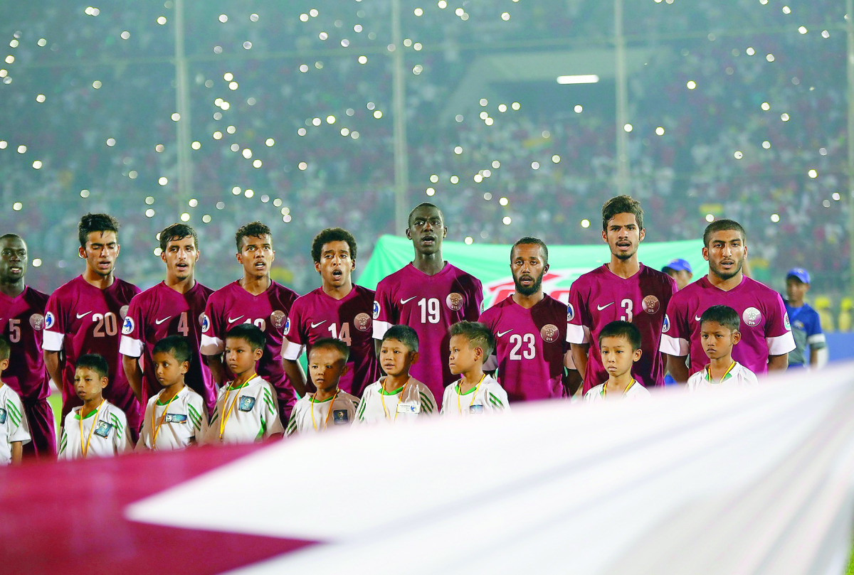 Qatari players sing their national anthem before the Asian Football Confederation Under-19 Championship semi-final match against Myanmar at the Thuwunna Youth Training Centre Stadium in Yangon in this October 2014 file photo. 