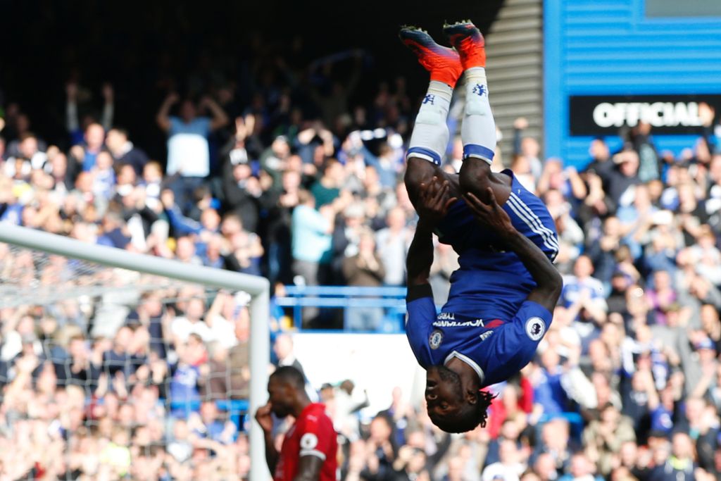 Chelsea's Nigerian midfielder Victor Moses (R) celebrates after scoring their third goal during the English Premier League football match between Chelsea and Leicester City at Stamford Bridge in London on October 15, 2016. Chelsea won the game 3-0.  AFP /
