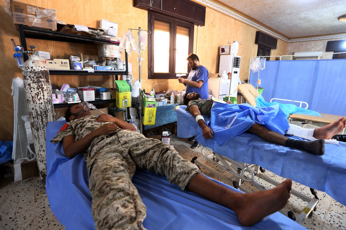 Members of the forces loyal to Libya's UN-backed Government of National Accord (GNA) are seen in a field hospital in the coastal city of Sirte, east of the capital Tripoli, during their military operation to clear the Islamic State group's (IS) jihadists 