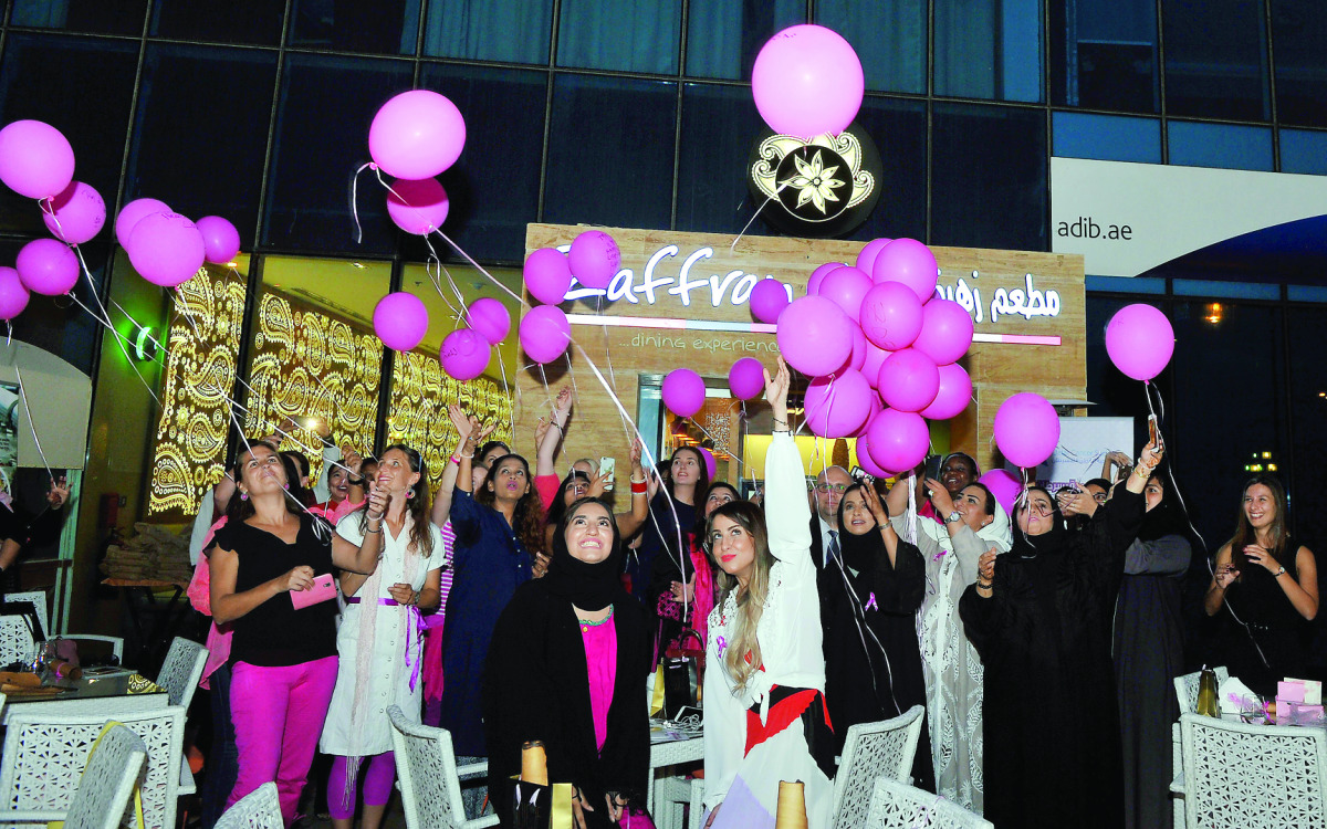 Participants release pink balloons during the ‘Pink High-Tea’ Breast Cancer Awareness Campaign held in the presence of Aliazi Al Kuwari, CEO of Gulf Society of Special Needs, at Zaffran Dining Experience yesterday. The event was organised by iQatar and su