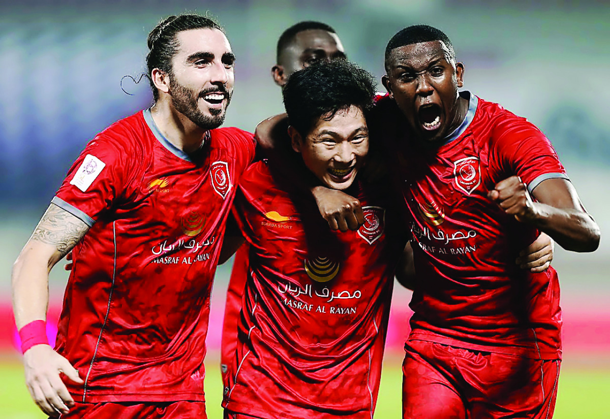 Players of Lekhwiya celebrate a goal during the Qatar Stars League (QSL) match against Al Sadd at Lekhwiya Stadium in Doha yesterday. The match ended in a thrilling three-all draw. 