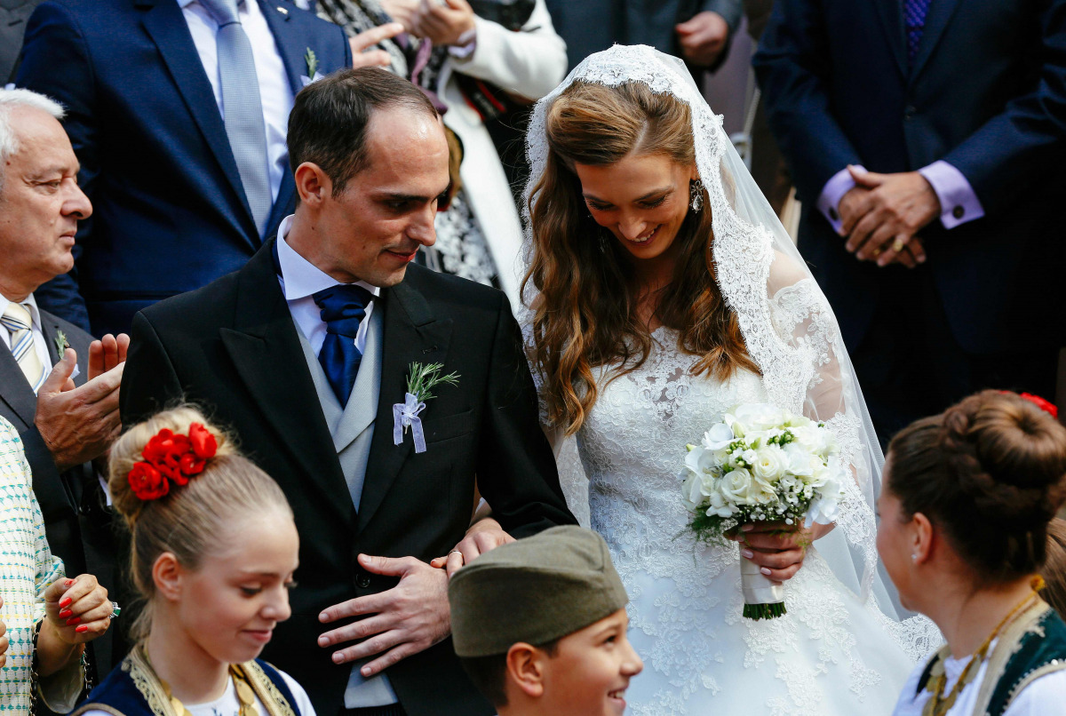 Prince Mihailo Karadjordjevic (L) and his bride Ljubica Ljubisavljevic exit after their wedding ceremony at the St. George's Church in Oplenac, near the central Serbian town of Topola, on October 23, 2016. Prince Mihajlo Karadjordjevic's wedding on Octobe