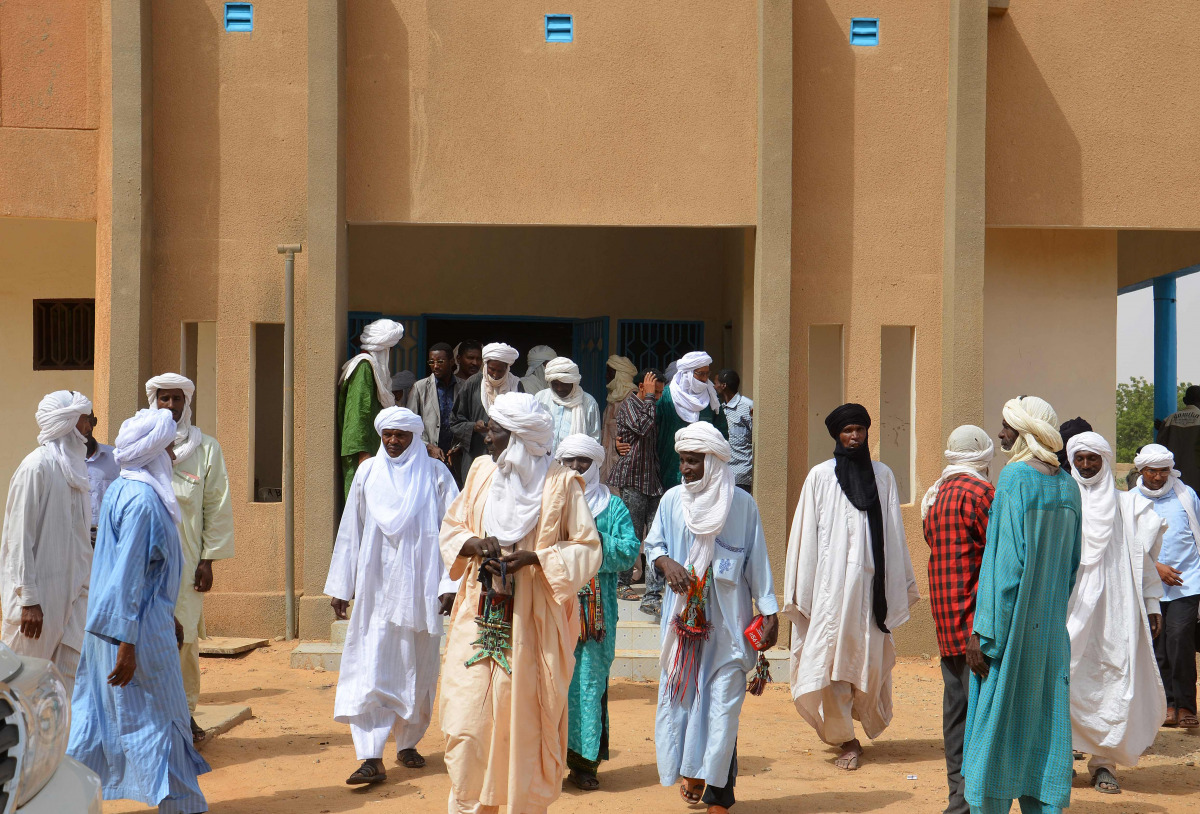 A picture taken on October 19, 2016 shows local officials leaving the town hall following a meeting with Niger's interior minister to discuss security issues in their region following the kidnapping of a US aid worker on October 14 by armed men in Abalak