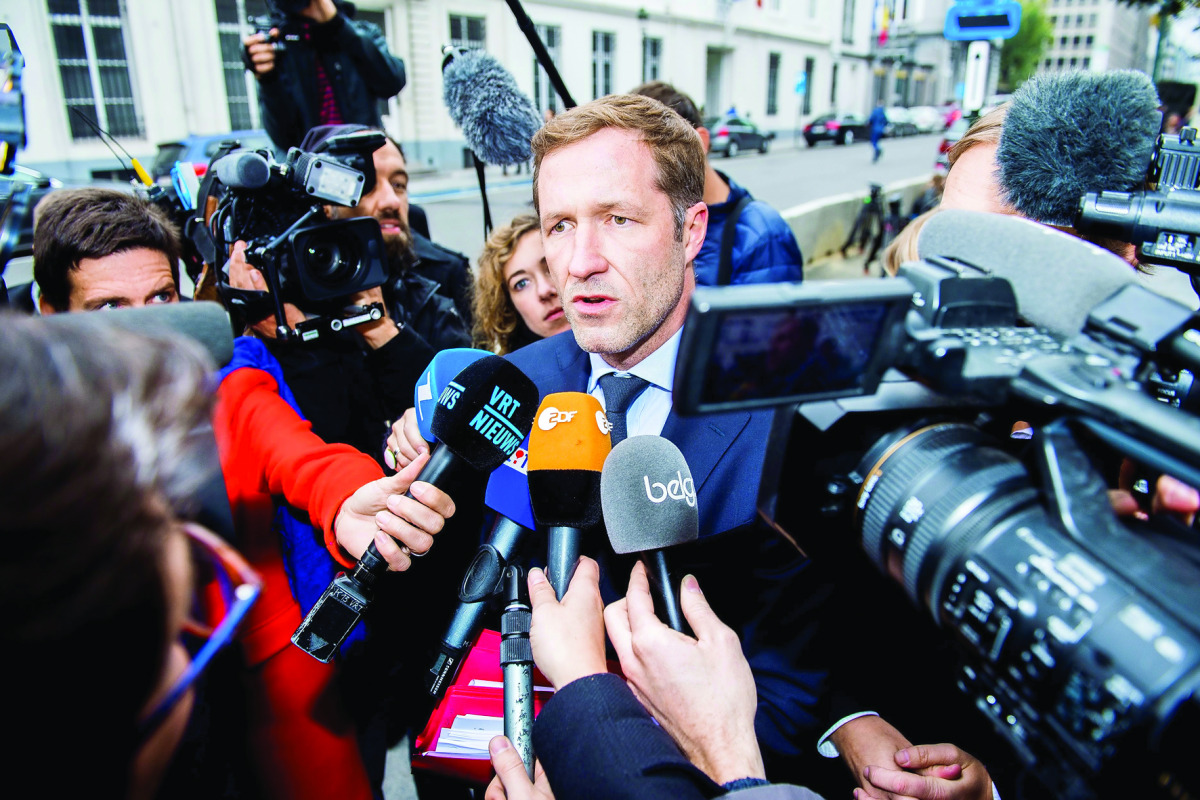 Minister-President of Belgium’s French-speaking Walloon Region Paul Magnette answers journalists as he arrives for an emergency meeting of all Belgium federal entities on the EU-Canada Comprehensive Economic and Trade Agreement (CETA) in Brussels, yesterd