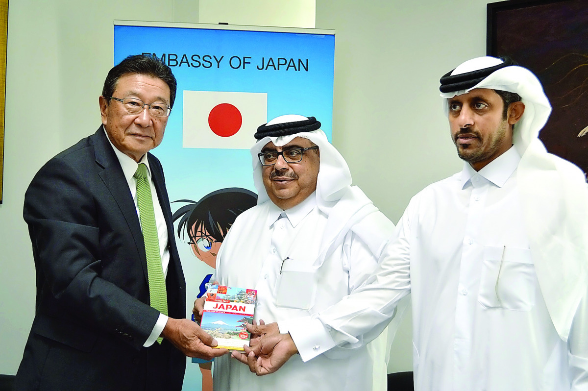 Japanese Ambassador Shingo Tsuda (left) donating a book to Ibrahim Al Sayed, Director of Public Libraries & Heritage Department (centre) and Abdul Rahman Al Hatmi, Director of Supply Department, Qatar Public library.