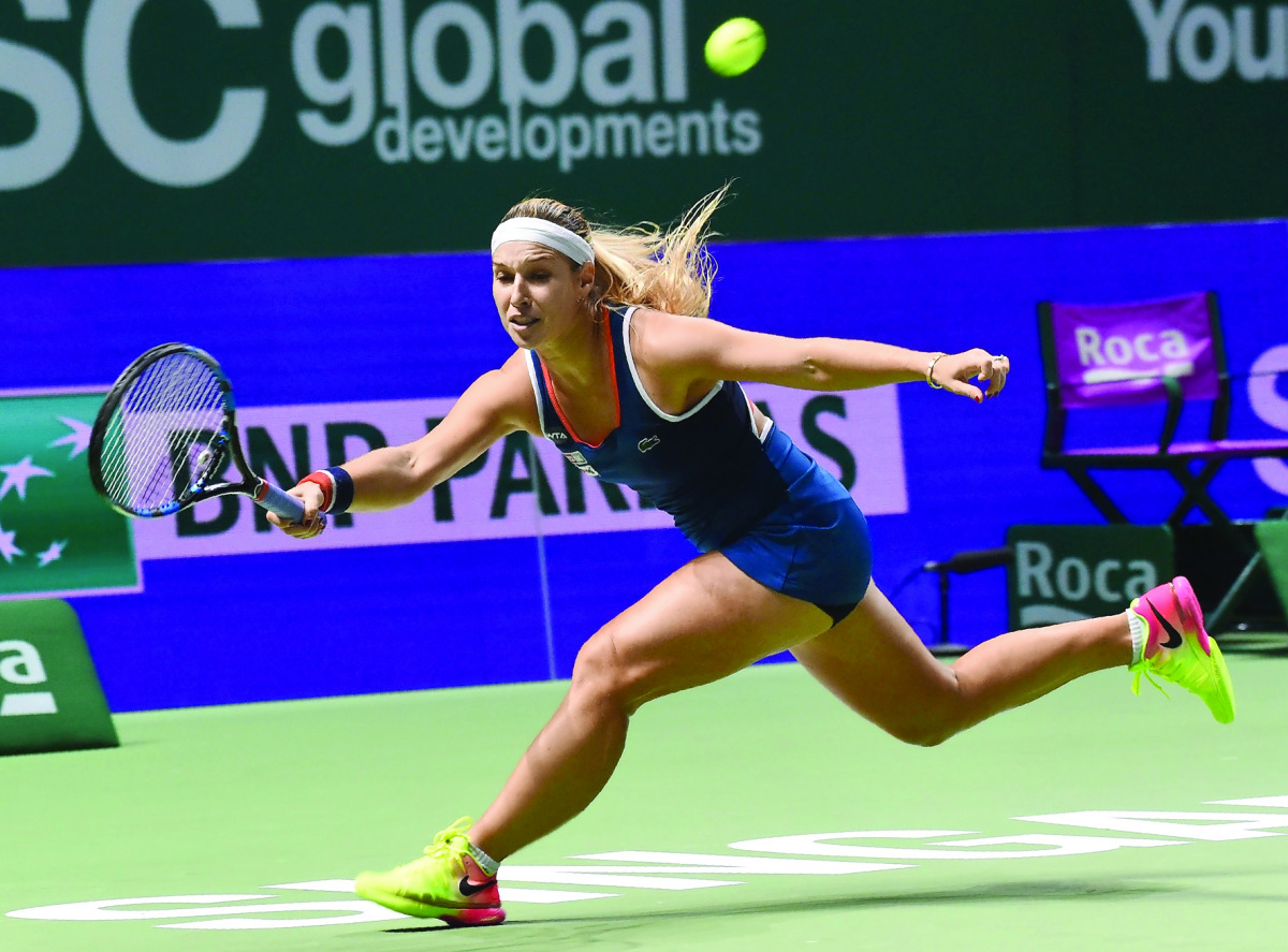 Dominika Cibulkova of Slovakia hits a return against Angelique Kerber of Germany during their women's singles final match at the WTA Finals tennis tournament in Singapore, yesterday.