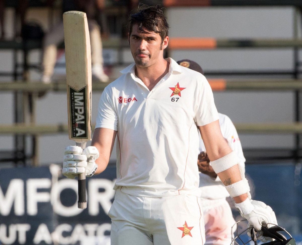 Zimbabwe captain Graeme Cremer celebrates scoring a century (100 runs) during the third day of the first Cricket Test match between Sri Lanka and hosts Zimbabwe at the Harare Sports Club, on October 31, 2016. (AFP / Jekesai Njikizana)