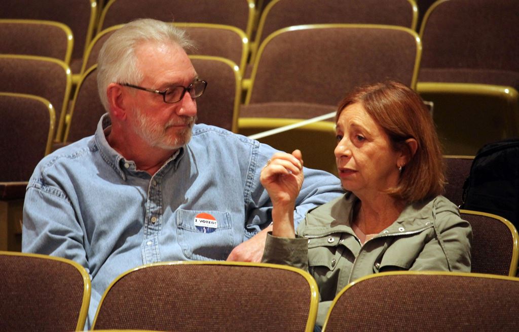 Mike Andrews(L) and Judy Osgood, both childhood friends of Democratic presidential nominee Hillary Clinton, discuss the US Presidential election and their high school classmate's front runner status, October 26, 2016 in Park Ridge, Illinois on the day tha