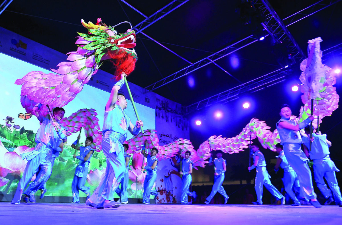Artistes from China’s Zhejiang Province perform the traditional Lotus Dragon dance marking the opening of the Chinese Festival yesterday at Museum of Islamic Art Park. Pic: Baher Amin / The Peninsula