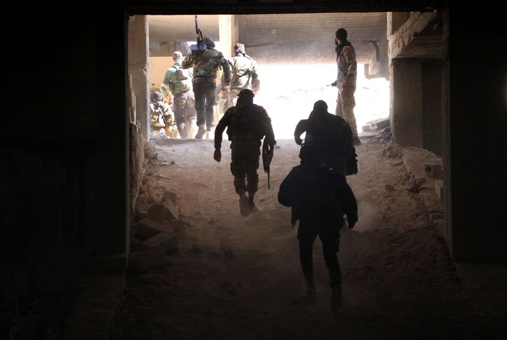 Rebel fighters from the Jaish al-Fatah (or Army of Conquest) brigades gather in position on November 3, 2016, at an entrance to Aleppo, in the southwestern frontline near the neighbourhood of Dahiyet al-Assad, during a rebel offensive to break a three-mon