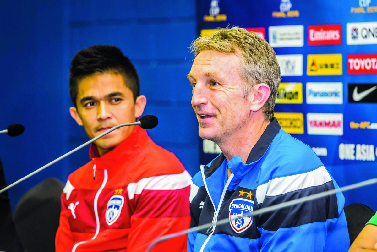 Bengaluru FC captain Sunil Chhetri (left) and coach Albert Roca speaking on the eve of the AFC Cup final in Doha
