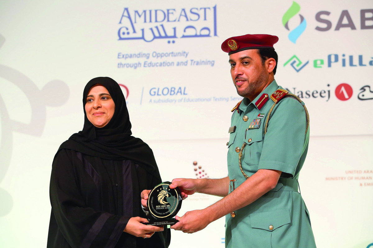 Fatima Haidar, Chief Human Resources Officer at HMC, receiving the award.