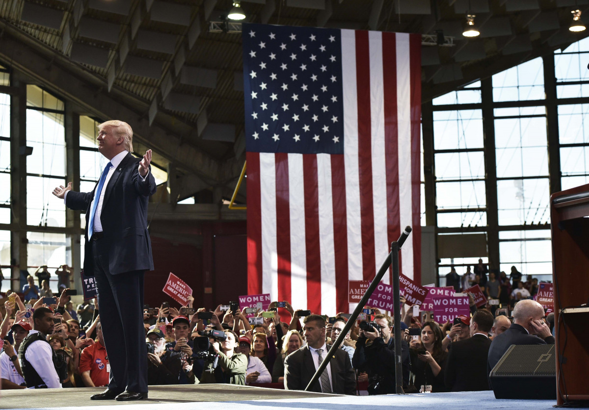 Republican presidential nominee Donald Trump arrives for a rally at the J.S. Dorton Arena in Raleigh, North Carolina on November 7, 2016. Hillary Clinton and Donald Trump battled for votes on a frenzied final day of campaigning Monday, telling Americans t