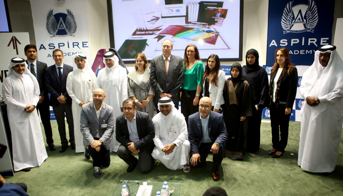 The members of the 'Kun Riyadi' (Be an Athlete), programme, a unique Athlete Development Pathway (ADP) model, pose for a picture with Dr Kuwari, QOC General Secretary and Ivan Bravo, Director General of Aspire Academy in Doha yesterday. (Picture by: Kammu